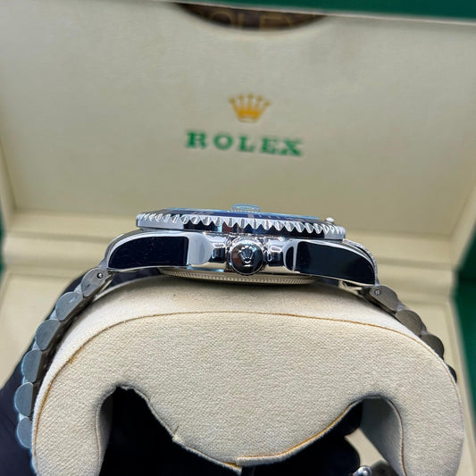 Rolex submariner silver with blue rotating dial with date